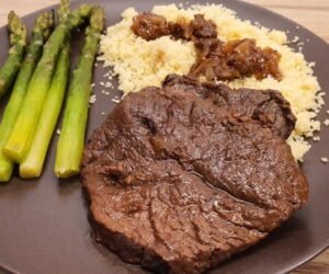 Dutch oven braised sliced beef couscous asparagus
