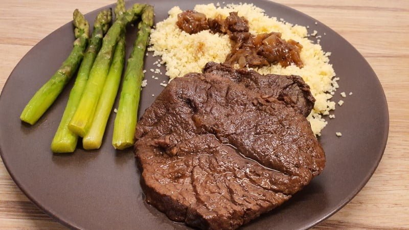 Dutch oven braised sliced beef couscous asparagus
