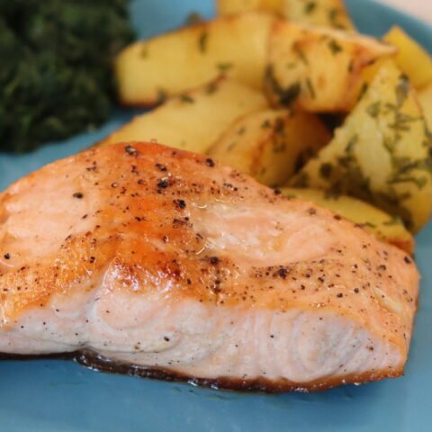 Baked salmon fillet potato spinach square