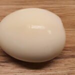 Peeled hard boiled egg