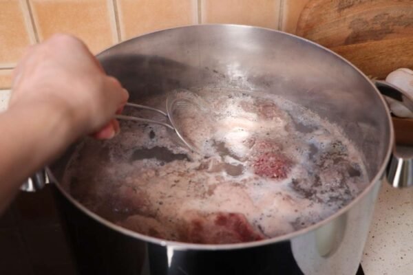 Removing foam from beef soup