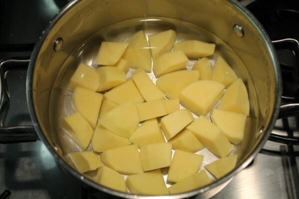 Cubed potatoes in water