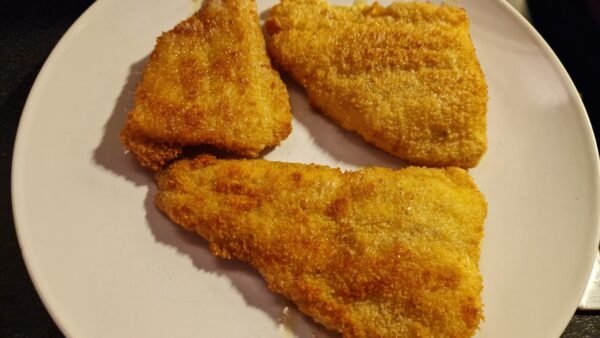 Fried breaded fish slices for stjerneskud