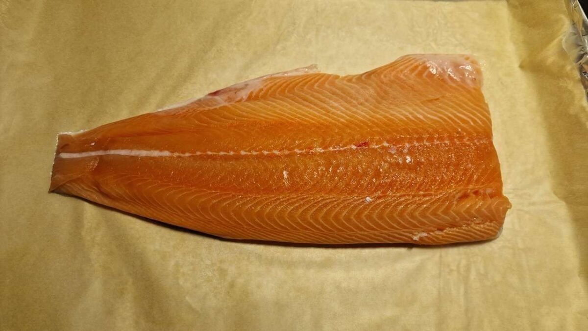 Half Salmon on a Baking Sheet