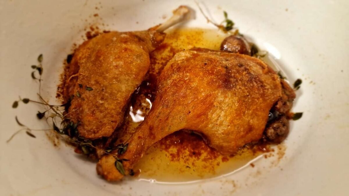 Roasted duck legs in a dish