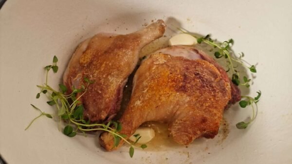 Seared duck legs with garlic and thyme