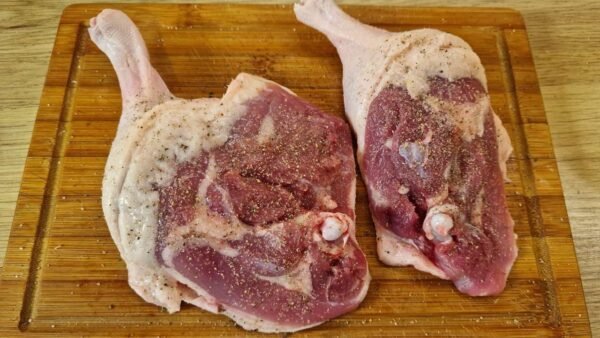 Seasoning the duck legs