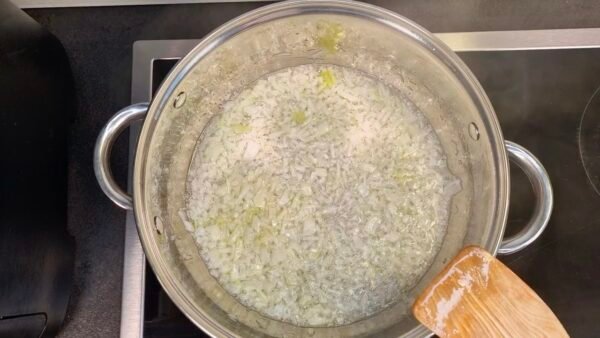 Sautéing onion in rendered fat