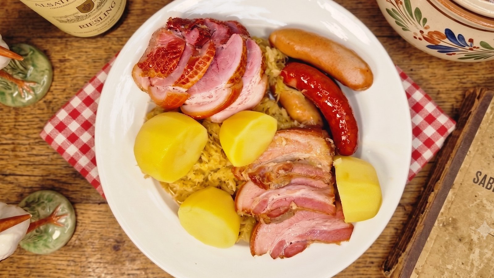 Choucroute garnie served with sauerkraut, smoked meats, sausages, and potatoes