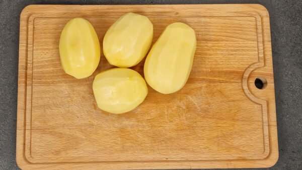 Peeled whole potatoes ready to be boiled