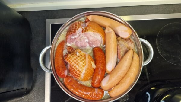 Sausages and frankfurters simmering with the sauerkraut