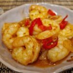 Close-up of gambas pil pil with shrimp in garlic-and-paprika oil