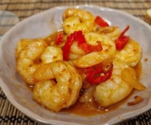 Close-up of gambas pil pil with shrimp in garlic-and-paprika oil