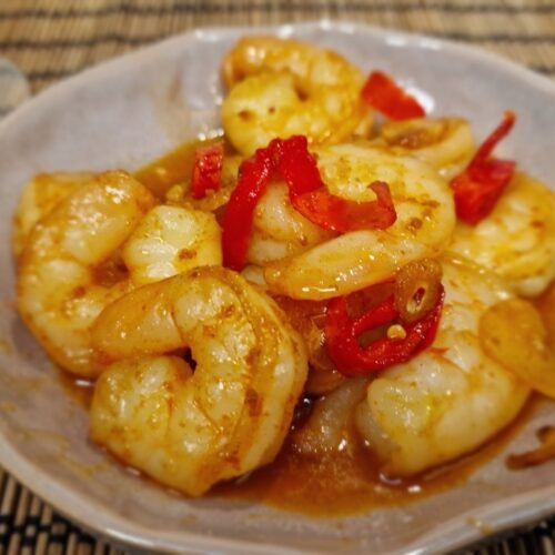 Close-up of gambas pil pil with shrimp in garlic-and-paprika oil