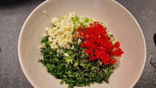 Finely chopped parsley, oregano, scallions, garlic, and chile