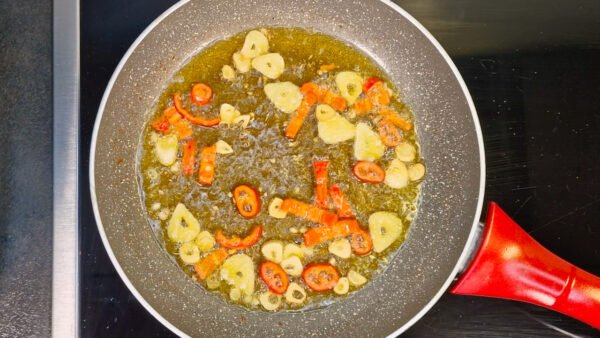 Garlic and chili cooking in olive oil