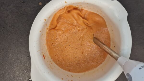 Gazpacho ingredients being puréed until smooth