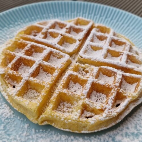 Belgian waffle dusted with powdered sugar