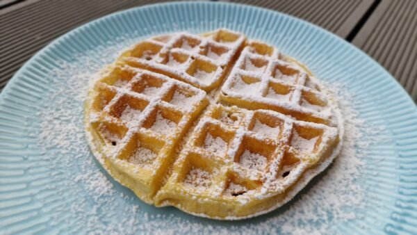 Belgian waffle dusted with powdered sugar