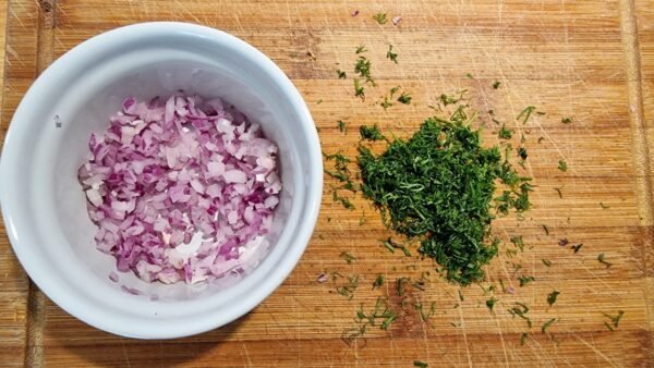 Finely chopped red onion and dill