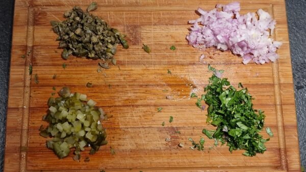 Chopped shallot, capers, pickle, and parsley