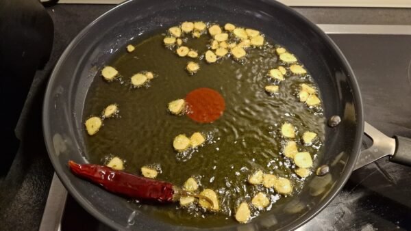 Garlic and chili cooking in olive oil