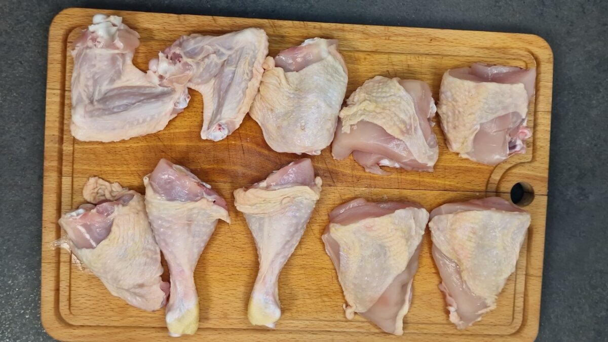 Pollo al ajillo and fried potatoes viewed from above
