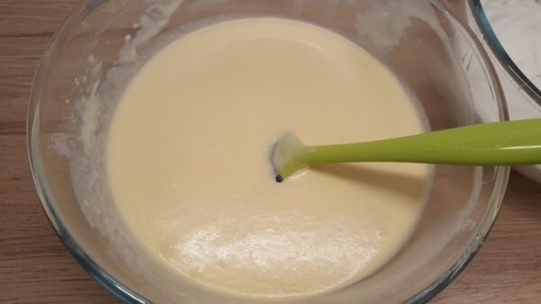 Mixing the egg yolk and milk mixture into the dry ingredients