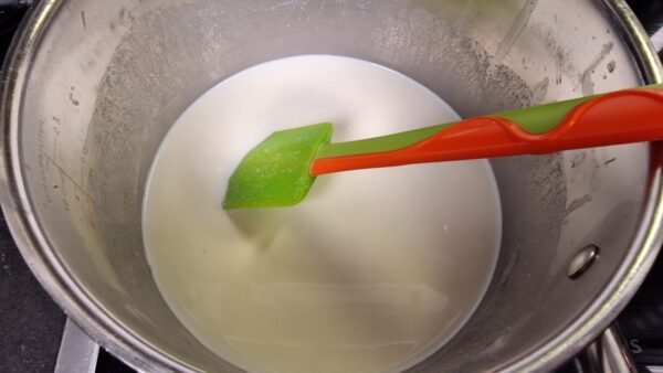 Hot milk added to the béchamel base