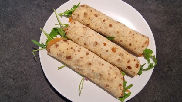 Smoked salmon lompe rolls before slicing