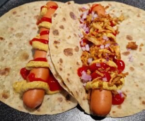 Traditional Norwegian hot dog wrapped in lompe
