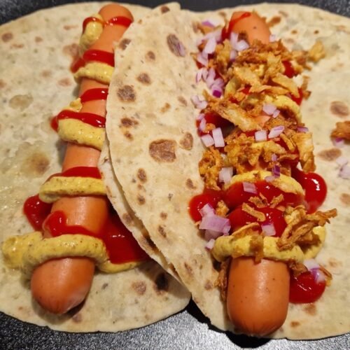 Traditional Norwegian hot dog wrapped in lompe